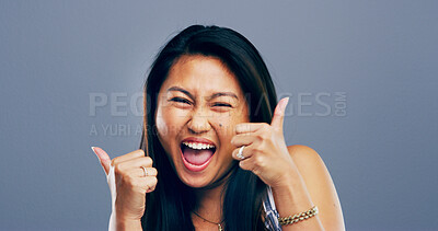 Buy stock photo Thumbs up, vote or portrait of Asian woman in studio for approval, success or feedback. Like emoji, yes sign and agreement with female person on background space for smile, symbol or promotion icon  