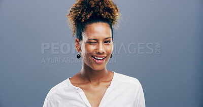 Buy stock photo Wink, african and portrait of woman in studio for secret, agreement and support gesture. Happiness, feedback and thank you with female person on background for review, achievement and well done sign