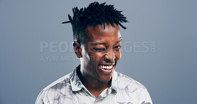 Buy stock photo Wink, secret and portrait of black man in studio for smile, agreement and joke gesture. Happiness, comic feedback and thank you with male person on background for review, comedy and funny sign