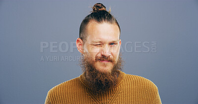 Buy stock photo Wink, hipster and portrait of man in studio for secret, agreement and support gesture. Happiness, feedback and thank you with male person on background for review, achievement and well done mockup