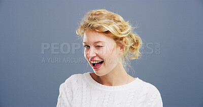 Buy stock photo Wink, smile and  portrait of woman in studio for secret, agreement and support gesture. Happiness, feedback and thank you with person on background for review, achievement and well done space