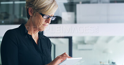 Buy stock photo Business, tablet and mature woman in office, typing and internet with website information. Person, financial advisor and employee in workplace, tech and network with digital app for trading and email