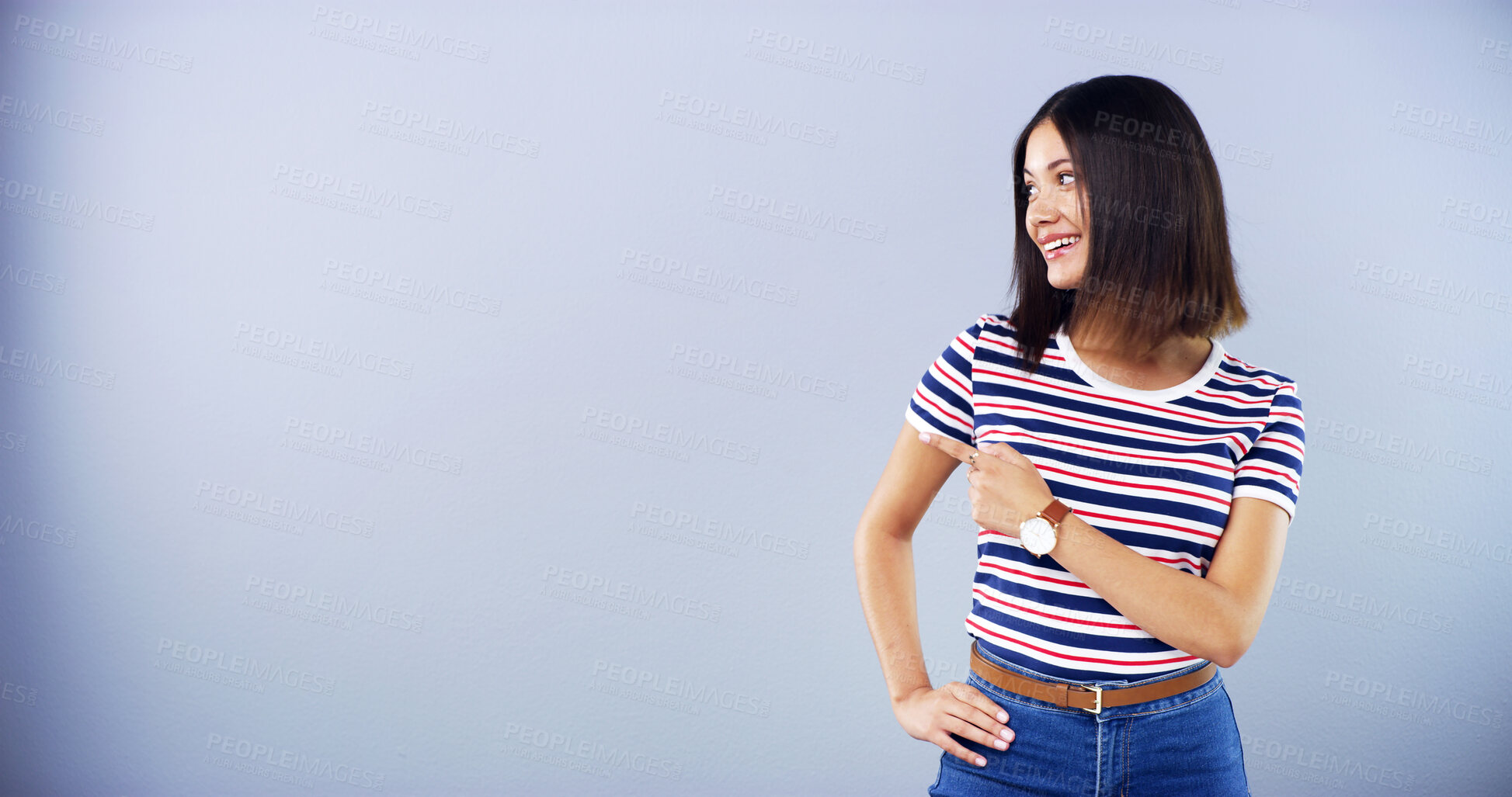 Buy stock photo Advertising, happy and woman with pointing in studio for promotion deal, offer announcement and mockup. Marketing, space and gesture for launch information, about us and sale news on blue background