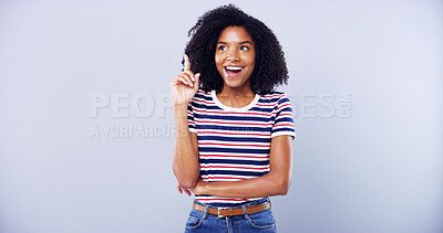 Buy stock photo Surprised, woman and student pointing in studio with announcement ideas, scholarship news and sign up. Space, person and solution decision with education offer, information guide and blue background