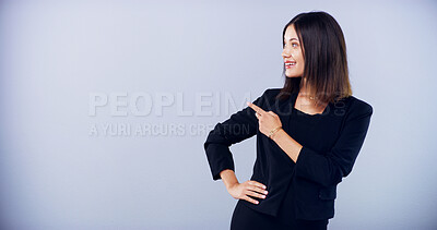Buy stock photo Business, woman and pointing direction in studio with announcement, promotion and sign up. Female person, show and timeline guide with job offer, about us info and opportunity news on blue background