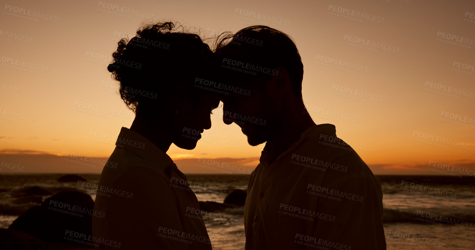 Buy stock photo Face touch, beach and couple at sunset for bonding, relationship and relax on weekend. Dating, travel and silhouette of man and woman by ocean for romance on holiday, vacation and love in nature