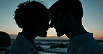 Forehead touch, beach and silhouette of couple at sunset for bonding, relationship and relax on weekend. Dating, travel and man and woman by ocean for romance on holiday, vacation and love in nature
