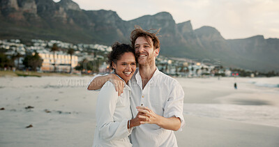 Buy stock photo Beach, happy interracial couple and holding hands for love, trust and healthy relationship. Seashore, man and woman hug outdoor for summer holiday, travel and romantic date with partner for support