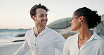 Vacation, travel and interracial couple at ocean for love, care and healthy relationship. Beach, happy man and woman outdoor for summer holiday, tourism or romantic date with partner for connection