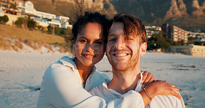 Buy stock photo Smile, couple and portrait at beach on holiday, summer vacation and travel together. Seashore, man and woman embrace outdoor for romantic date, love and care in interracial relationship with partner