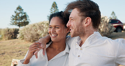Buy stock photo Relax, interracial couple and happy together outdoor for romantic date, anniversary weekend and holiday break. Smile, people and love in nature for travel adventure, trust and commitment in marriage