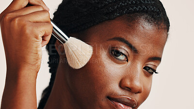 Buy stock photo Brush, makeup and portrait of black woman in studio with beauty or cosmetics for getting ready. Face, cosmetology and African female person with blush for facial color or glow by white background.