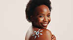 Portrait, woman and sunscreen on body in studio for hydration, treatment and sun protection. Person, spf cream and natural cosmetics for dermatology of skincare, anti aging shine and white background