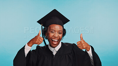 Buy stock photo Graduation, portrait and woman with thumbs up, excited or happiness for achievement, university and success. Blue background, college and black person with gesture, studio or smile for accomplishment