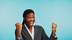 Success, business woman and fist pump to celebrate winning, good news or corporate milestone. African worker, excited or victory with achievement, goal or reward for triumph on blue studio background