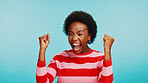 Screaming, winner and black woman with celebration in studio for lottery success, bonus prize and achievement. Mockup space, person and victory fist on blue background for good news and giveaway deal