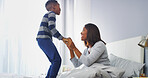 Bonding, mom and child in bedroom, smile and black family in house, conversation and affection for boy. Home, woman and love for son in morning, relax and single parent with kid in apartment or happy
