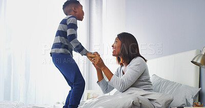 Buy stock photo Excited, mom and child in bedroom, smile and black family in house, bonding and affection for boy. Home, woman and love for son in morning, relax and single parent with kid in apartment or happy
