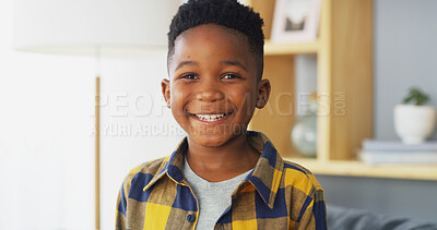 Buy stock photo Portrait, happy child and African boy in home for relax, calm and weekend break in living room. Face, smile and young cute kid with confidence, positive and growth for development in house in Nigeria