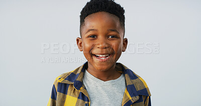 Buy stock photo Portrait, black child and boy laughing in studio with funny adorable model isolated on white background. Face, happy and young African kid with confidence, excited or growth for development in Kenya
