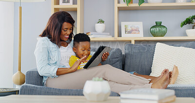 Buy stock photo Home, mother and boy on sofa, tablet and smile with online game, bonding together and relax in lounge. Black family, entertainment and social media with mama on couch, son or tech with digital app