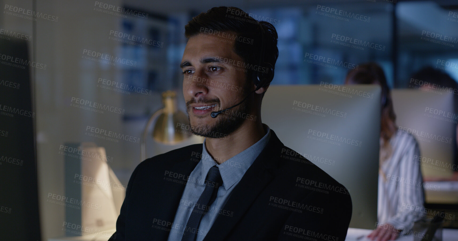 Buy stock photo Overtime, sales or businessman in call center with computer, communication or help in night. Virtual assistant, consultant or customer service agent with mic headset, online support or loan advice
