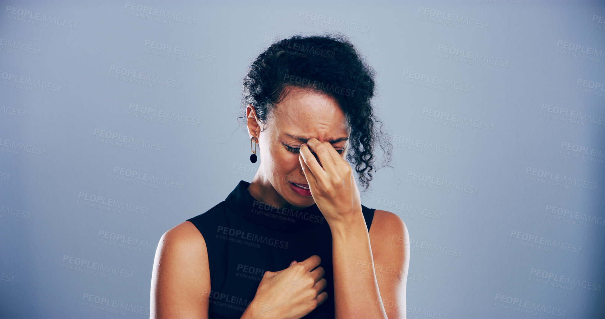 Buy stock photo Woman, sad and crying with emotions in studio for mourning loss, broken heart and bad news. Person, mockup space and grief with depression, mental health and ptsd for trauma memory on gray background
