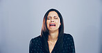 Sad woman, crying and emotion with grief for breakup, loss or mental breakdown on a studio background. Female person, model or heartbroken with sulk, tears or expression in sorrow for mourning pain