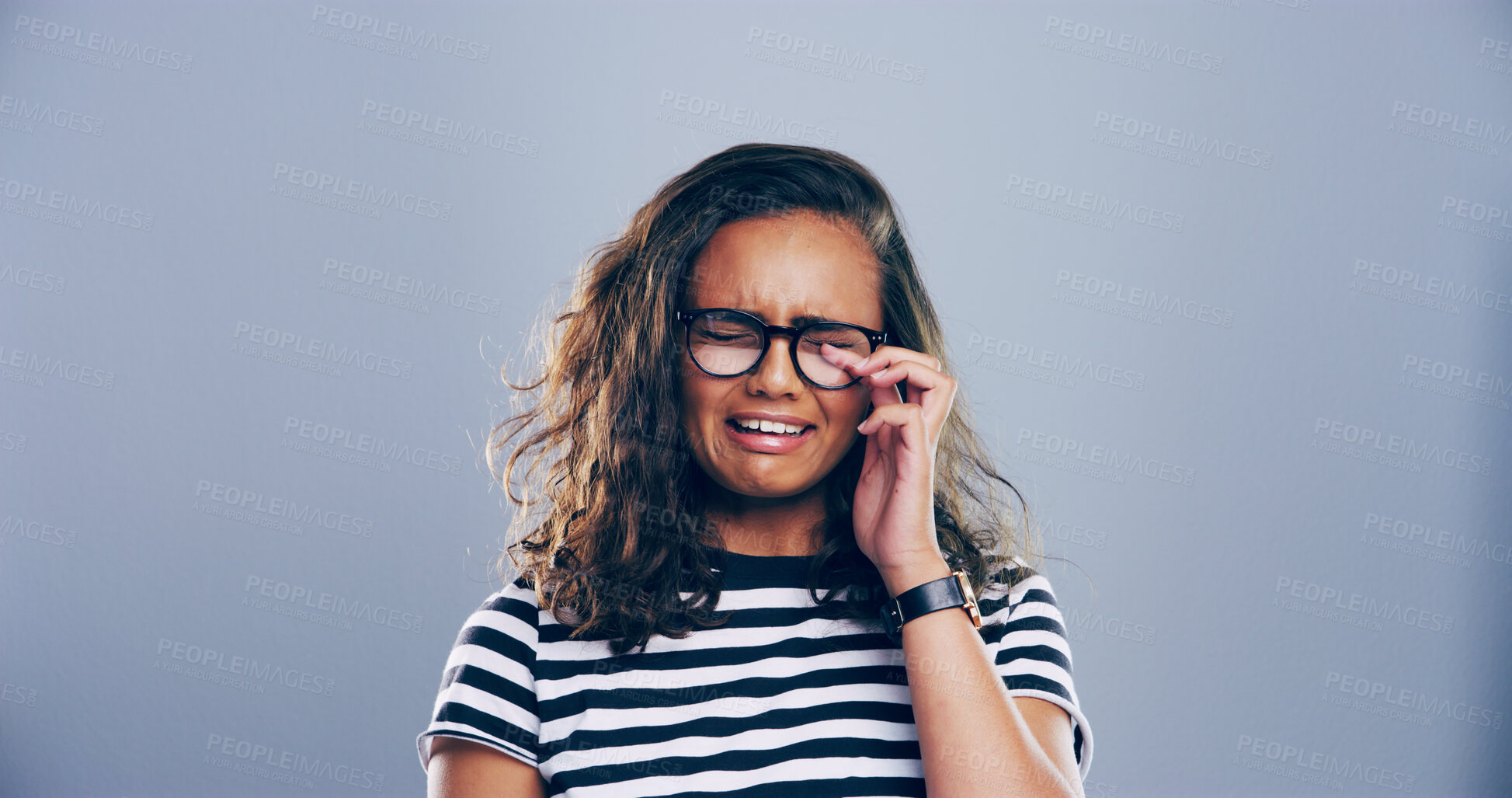 Buy stock photo Sad woman, crying and grief with glasses for breakup, loss or mental breakdown on a studio background. Female person, model or heartbreak with emotional sulk, tears or expression for loneliness
