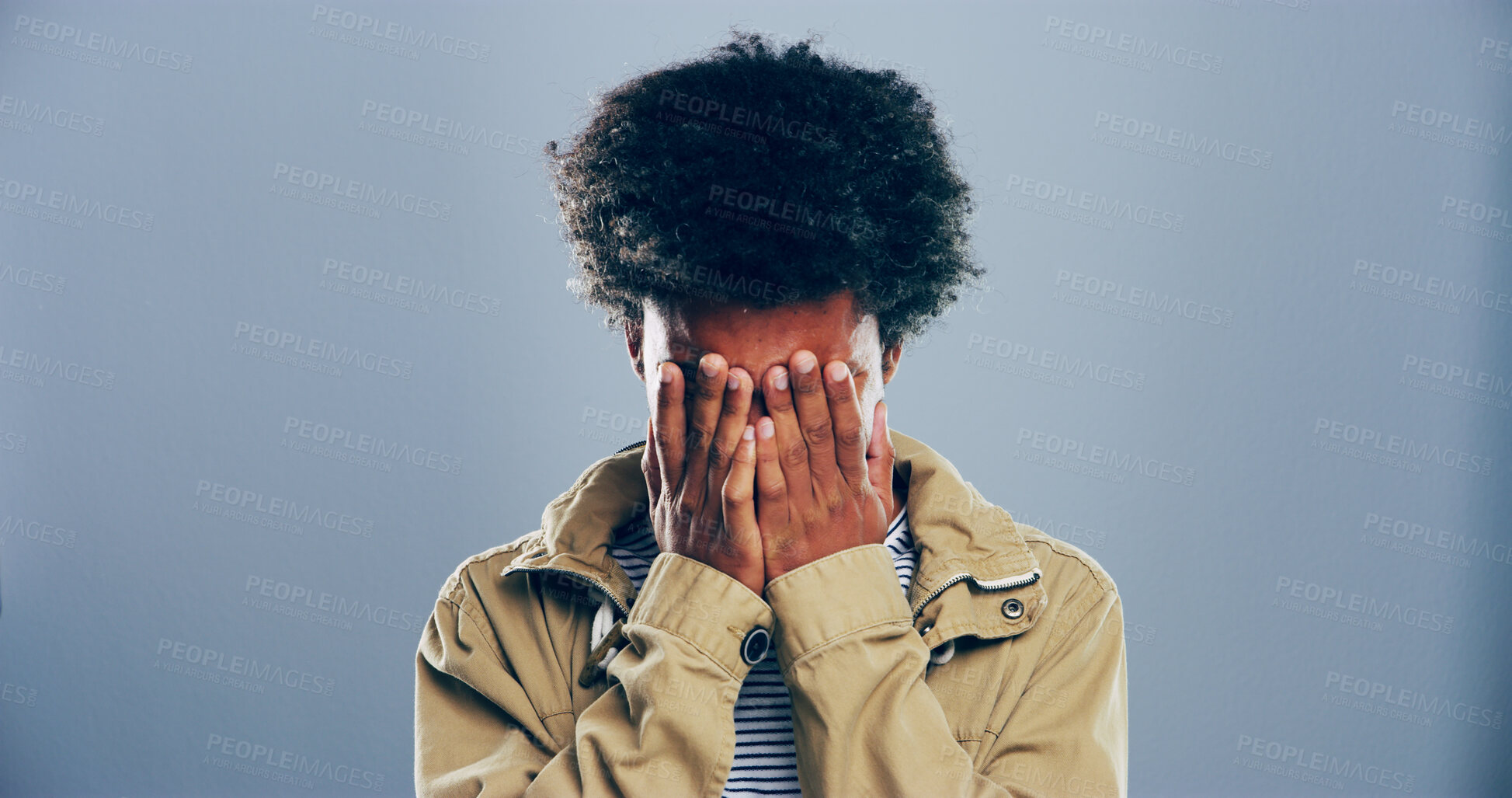 Buy stock photo Sad, black man and crying emotions in studio for mourning loss, broken heart and bad news. Person, mockup space and grief with depression, mental health and ptsd for trauma memory on gray background