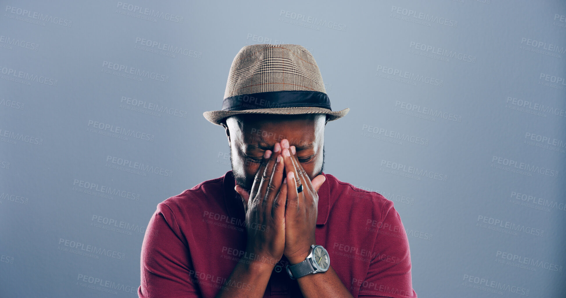 Buy stock photo Sad, black man and crying with hat for breakup, pain or cancelled vacation on a gray studio background. Male person, expression or sulk eyes with tears for missed flight or delay on mockup space