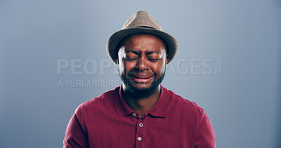 Buy stock photo Depression, black man and sad with crying in studio for broken heart, trauma and emotional breakup. Mockup space, person and unhappy on gray background with mental breakdown, bad news and loneliness