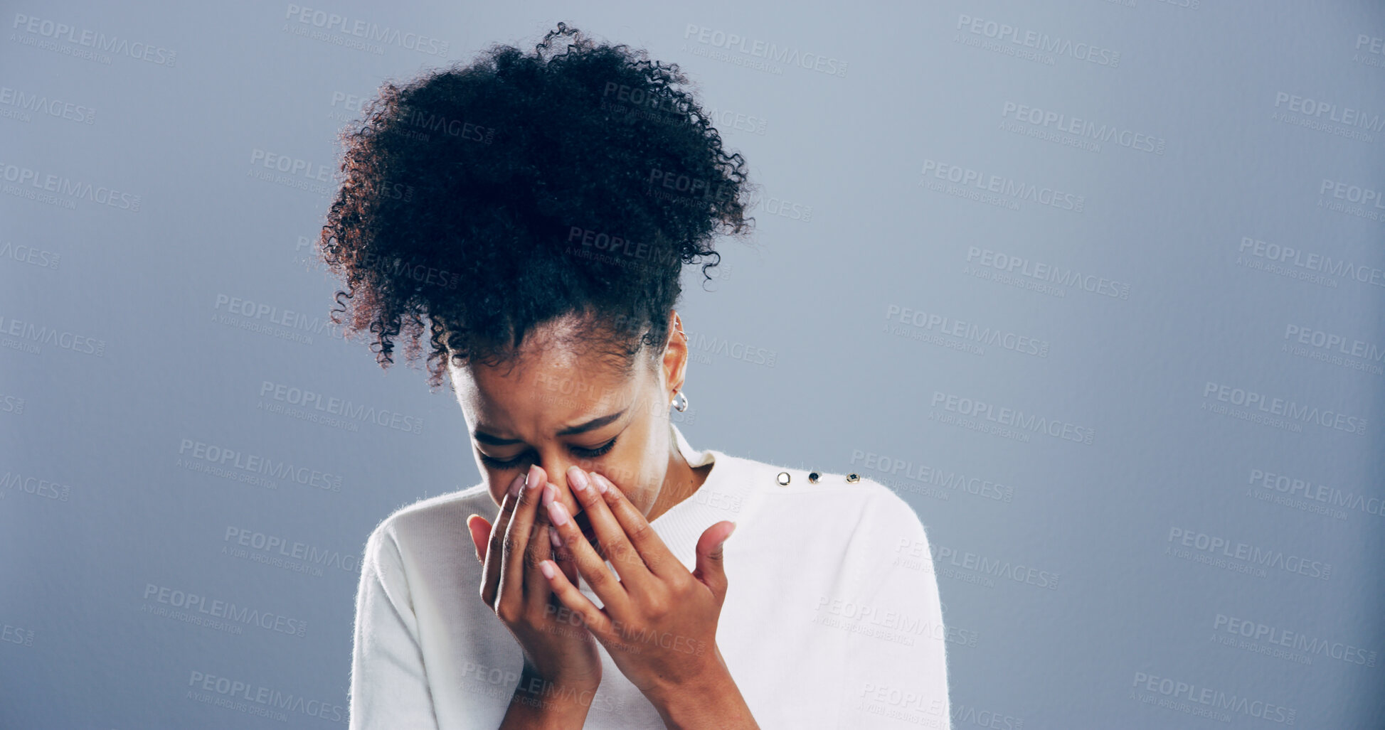 Buy stock photo Crying, sad and woman in studio, grief and emotional reaction on blue background. Person, model and girl with mockup space, stress and sorrow with loss of relationship, mourning and broken heart