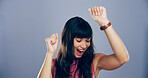 Dance, energy and music with happy woman in studio for celebration, clubbing or party fun. Disco, moving and smile of excited dancer person on gray background mockup for beat, choreography or rhythm