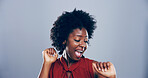 Dance, energy and smile of black woman in studio for celebration, clubbing or party fun. Afro, moving and music with excited African person on gray background mockup for beat, choreography or rhythm