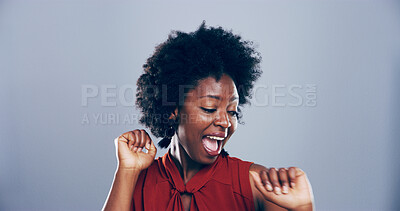 Buy stock photo Dance, energy and smile of black woman in studio for celebration, clubbing or party fun. Afro, moving and music with excited African person on gray background space for beat, choreography or rhythm