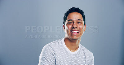 Buy stock photo Space, laughing or portrait of Indian man in studio with confidence, mockup or humor. Comedian, comic performer or face of happy person isolated on grey background with funny joke for creative career