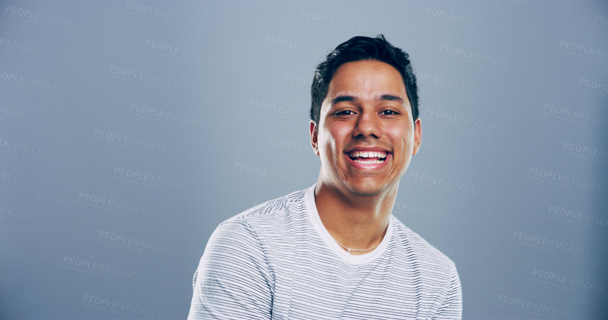 Buy stock photo Space, laughing or portrait of Indian man in studio with confidence, mockup or humor. Comedian, comic performer or face of happy person isolated on grey background with funny joke for creative career