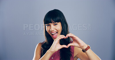 Buy stock photo Happy woman, portrait and heart hands with love sign, gesture or romance on grey background space in studio. Asian person, smile and emoji or shape, symbol and kindness for valentines day mockup