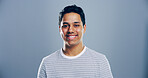 Fashion, studio and portrait of man, clothes or happy for scholarship in university, trendy or outfit. Mockup space, blue background and person with stylish tshirt, student or guy with smile in India