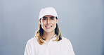 Sports, cap and portrait of woman in studio with wellness, confidence and proud smile on mockup space. Fitness coach, tennis player or happy face of professional female athlete on grey background