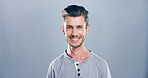 Confident, smile and portrait of man, fashion and graphic designer with casual outfit and studio. Mockup space, blue background and person with creative career, calm and stylish with clothes in USA