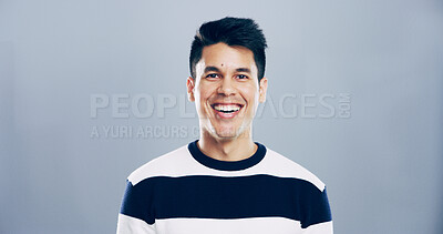 Buy stock photo Portrait, laugh and creative man in studio, comedy screenwriter and script author isolated on gray background. Face, funny and happy business person, professional and confidence with space in Spain
