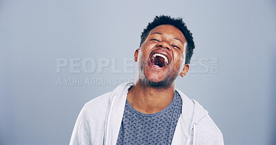 Buy stock photo Crazy, man and happy for laugh in studio with confidence, joke and good mood on gray background. Space, African model and smile with fun personality for comedy, humor or funny reaction to meme