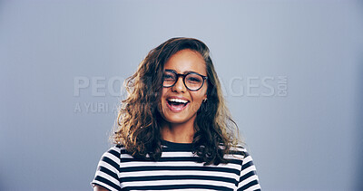 Buy stock photo Happy woman, portrait and laughing with glasses in studio, joy for opportunity in creative career or promotion. Space, female person and excited for goals as comic illustrator on gray background