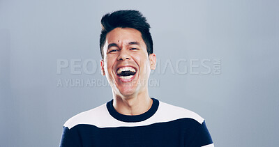 Buy stock photo Comic, man and portrait for laugh in studio with confidence, joke or good mood on gray background. Space, excited model and smile with carefree personality for comedy, humor or funny reaction to meme