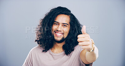 Buy stock photo Happy man, portrait or thumbs up with success for winning or approval on a gray studio background. Face, male person or model in joy with smile, like emoji or yes sign for okay, good job or well done