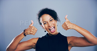 Buy stock photo Woman, portrait and excited with thumbs up in studio for vote approval, poll agreement and support. Mockup, person and happy feedback with yes gesture for positive review or praise on blue background