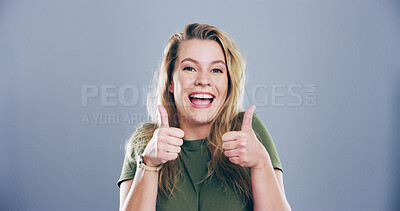 Buy stock photo Woman, portrait and happy with thumbs up in studio for vote agreement, poll success and support. Mockup, person and excited feedback with like gesture for positive review or praise on blue background