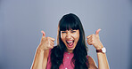 Girl, portrait and excited with thumbs up in studio for vote success, winning achievement or support. Space, woman or happy feedback with yes gesture for positive review or opinion on blue background
